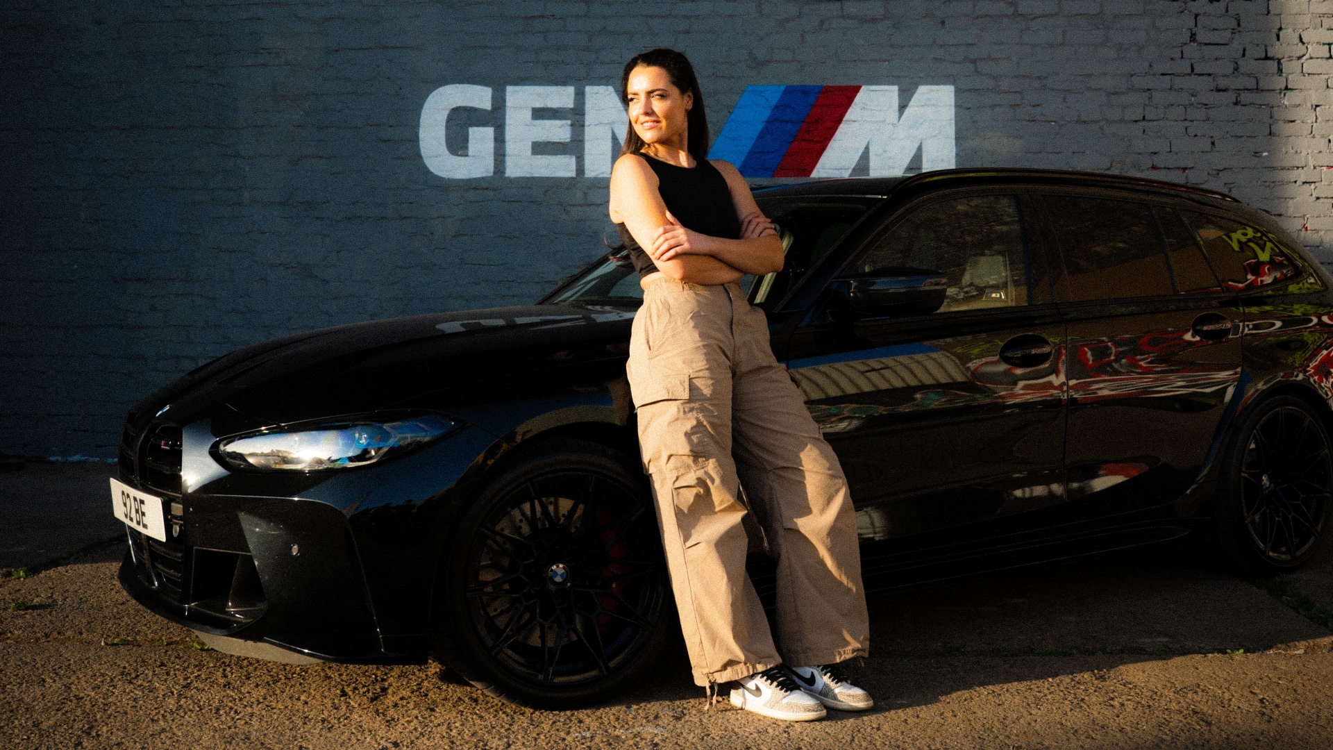 Becky Evans with her black BMW M3 Touring G81