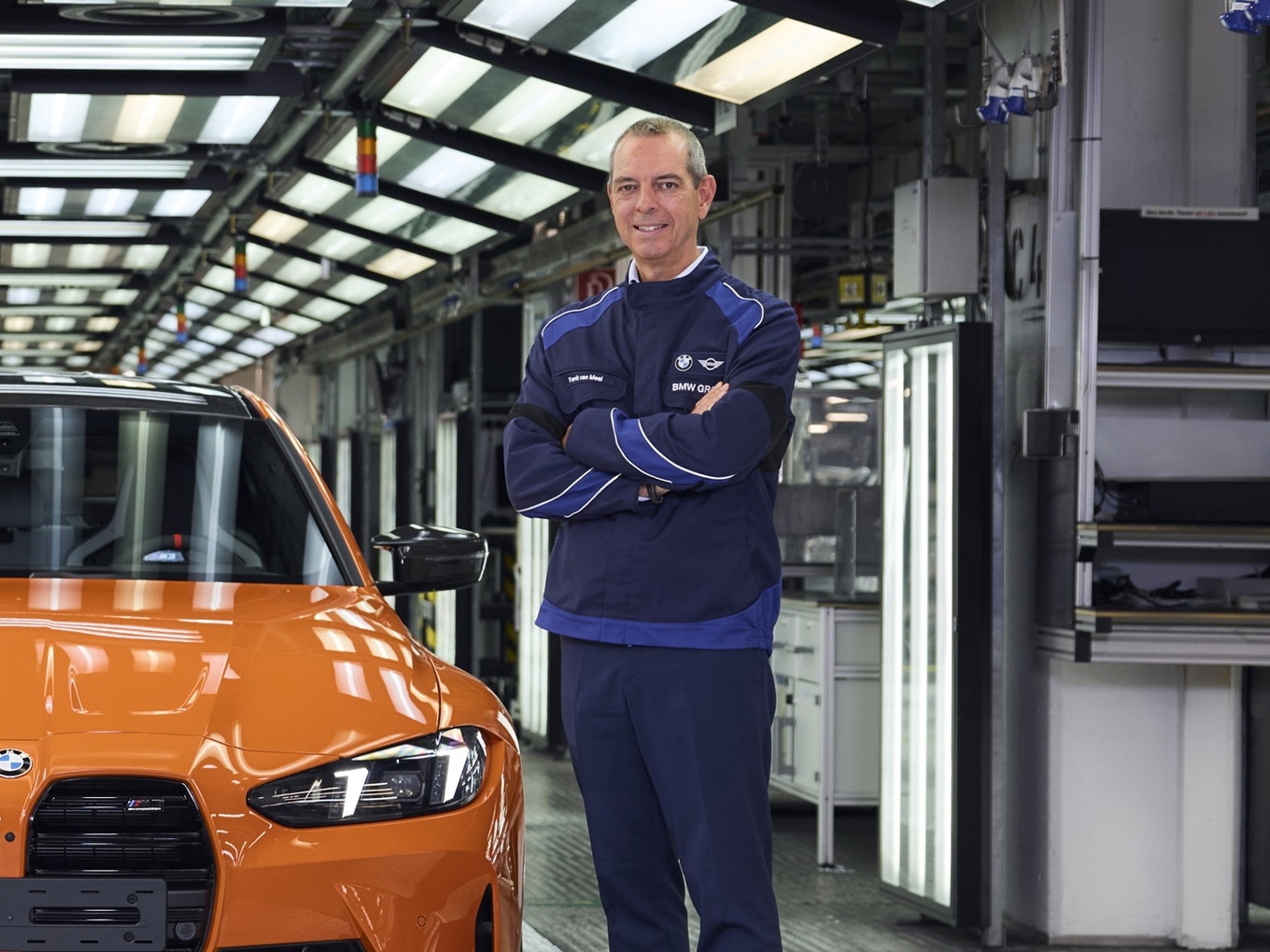 Franciscus van Meel, CEO of BMW M GmbH, next to the one-millionth BMW M, a BMW M3 in the colour Fire Orange.