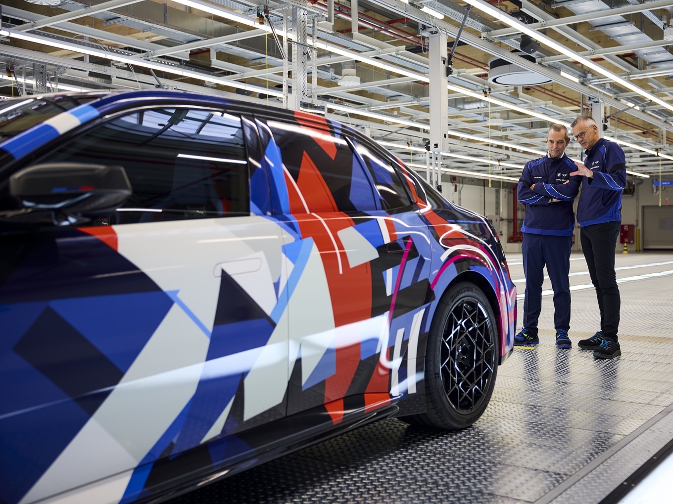 Franciscus van Meel and Peter Weber with the pre-production model of the BMW M3 in the BMW plant in Munich.