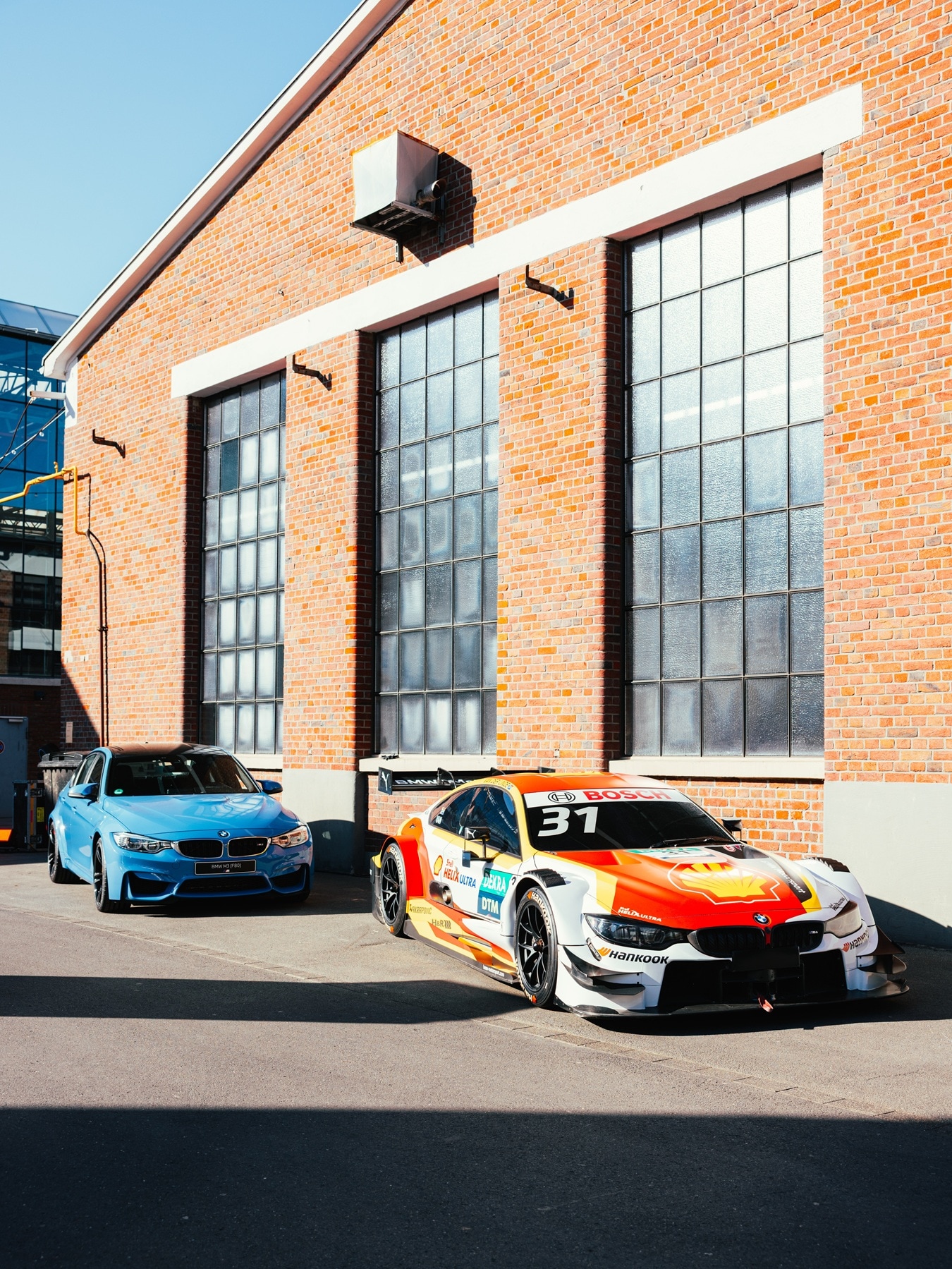 A road-legal and a racecar version of the BMW M3 F80.