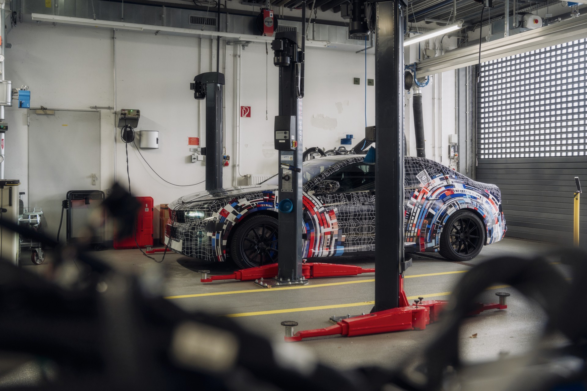 BMW M development workshop with electrically powered prototype.